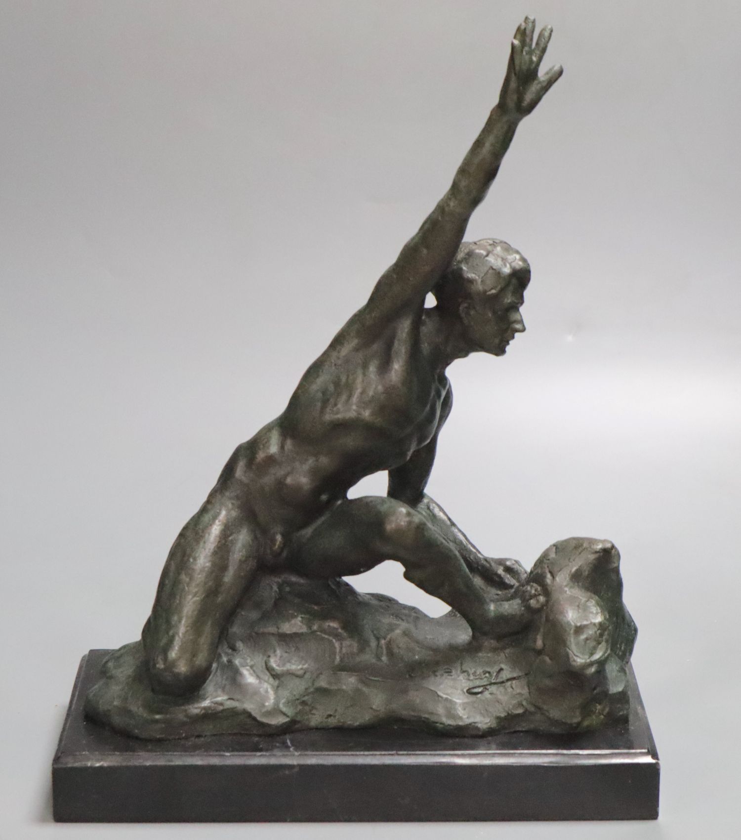A bronze of a nude male, on marble base, indistinctly signed, height 36cm